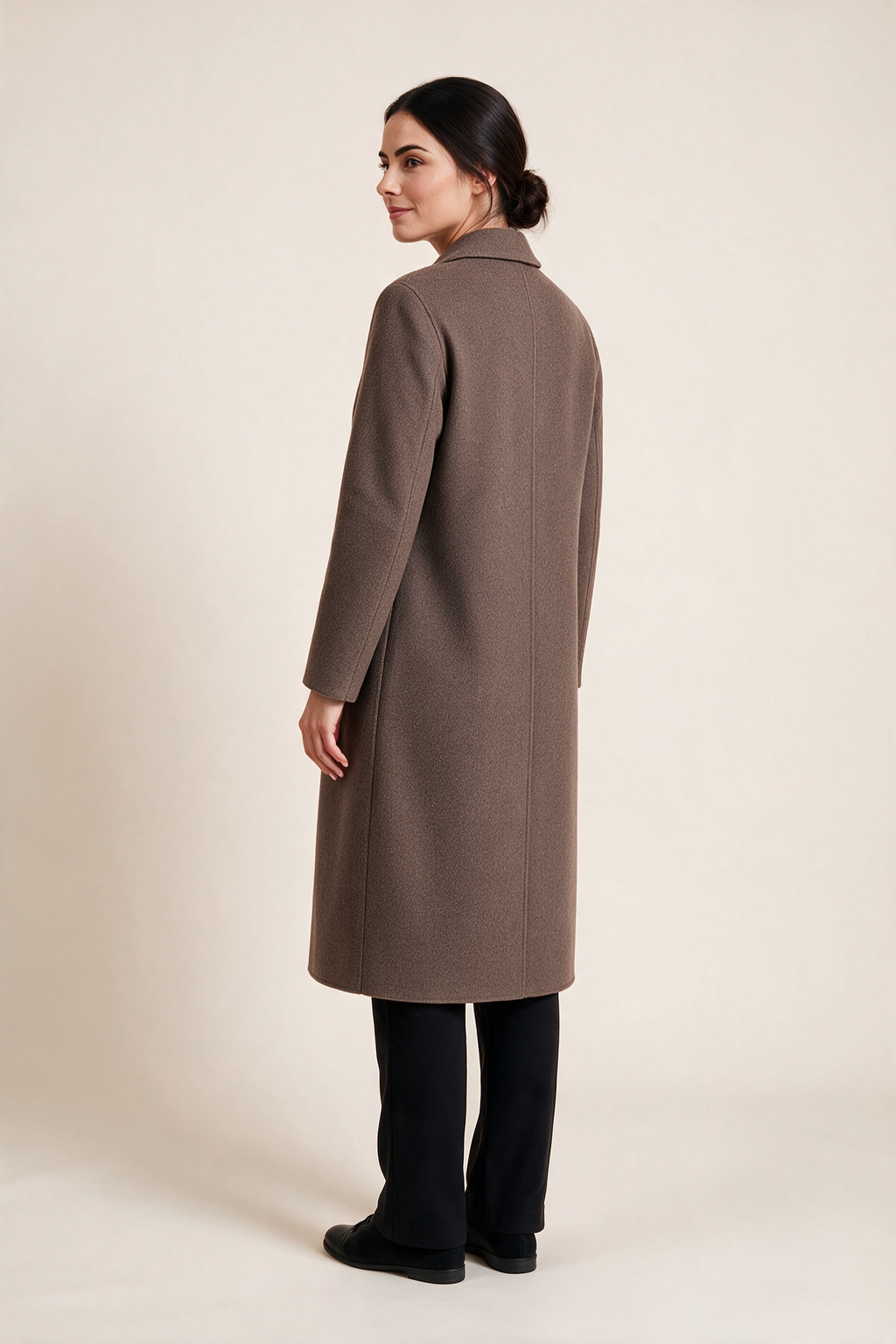 Essential midi coat — Taupe, worn by Sofia, rear view looking over her shoulder