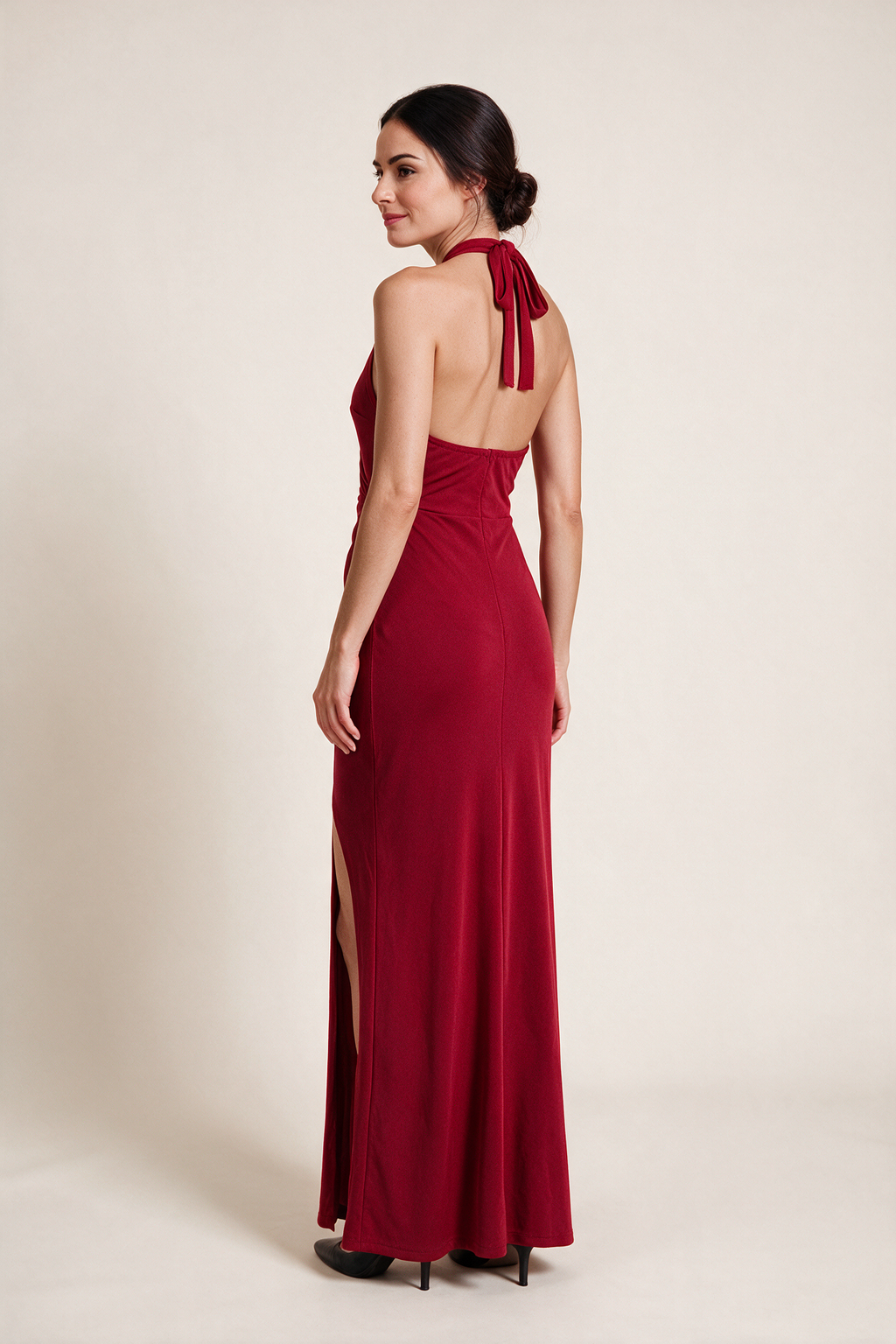 Long halter dress with slit — Red, worn by Sofia, rear view looking over her shoulder