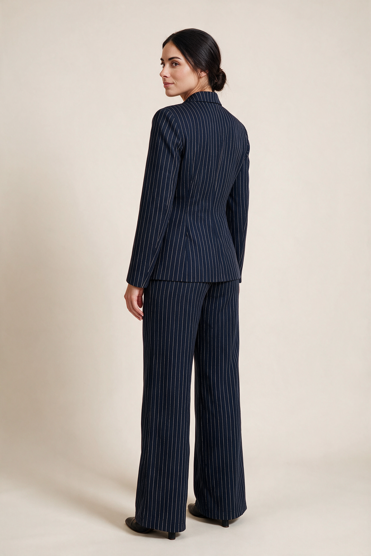 Double-breasted pinstripe suit — Midnight blue, worn by Sofia, rear view looking over her shoulder